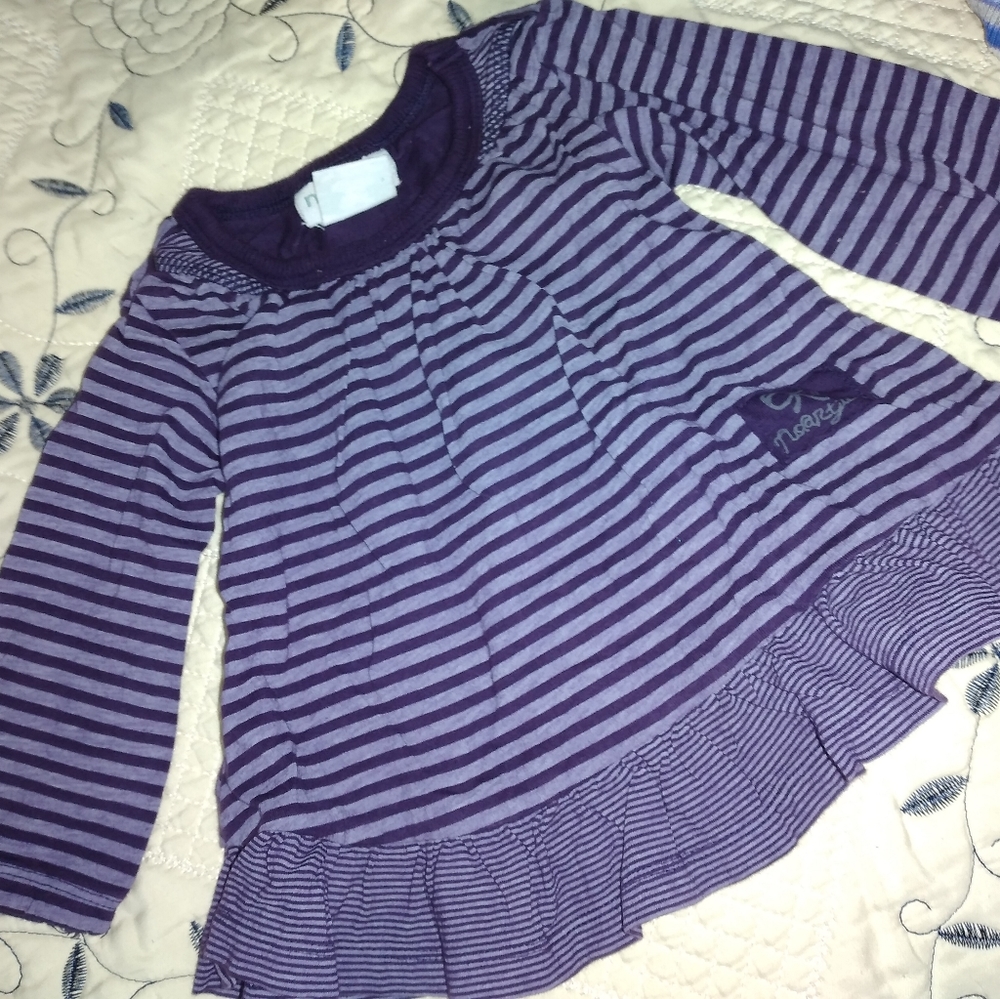 Blue shirt with long sleeves and has skirt